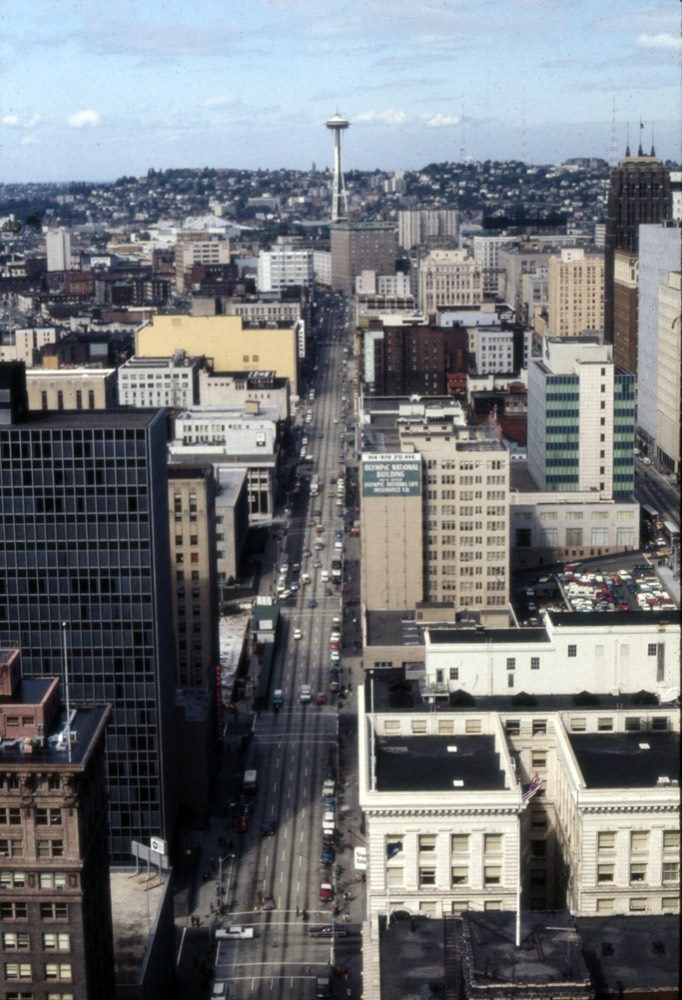 downtown Seattle street with the Space Needle in the distance, 1970s